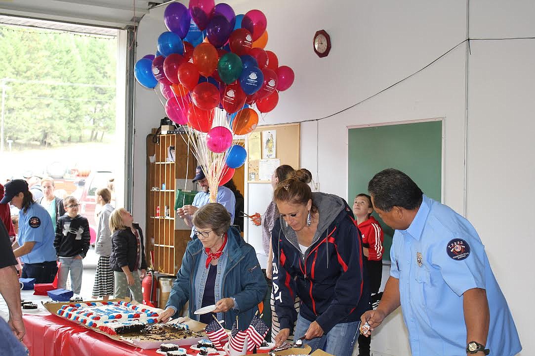 Community members enjoyed refreshments at last Saturday’s 9/11 Memorial event at the Thompson Falls Rural Fire Department. (Monte Turner/Valley Press)