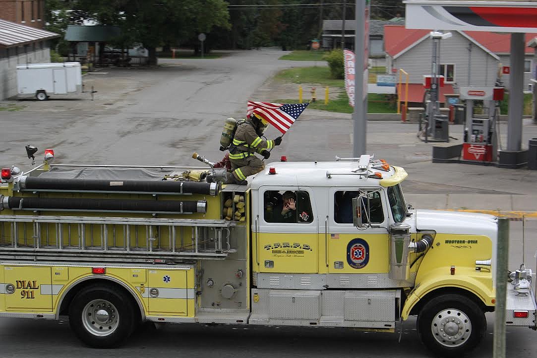 A Thompson Falls Rural Fire Department truck drives up Montana 200 during last Saturday’s parade. (Monte Turner/Valley Press)