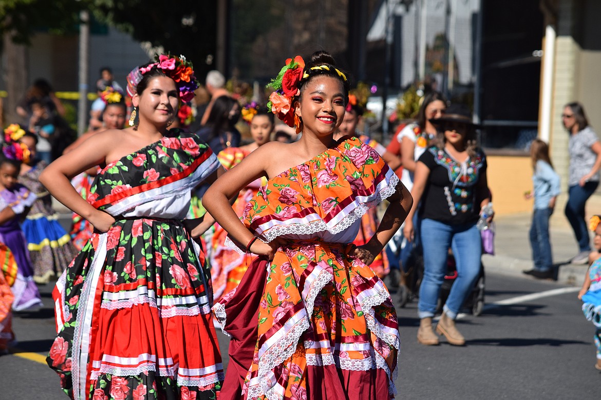 Dancers with Ballet Sol y Luna, a traditional Mexican dance troupe, perform in Quincy during the Farmer Consumer Awareness Day parade on Saturday.