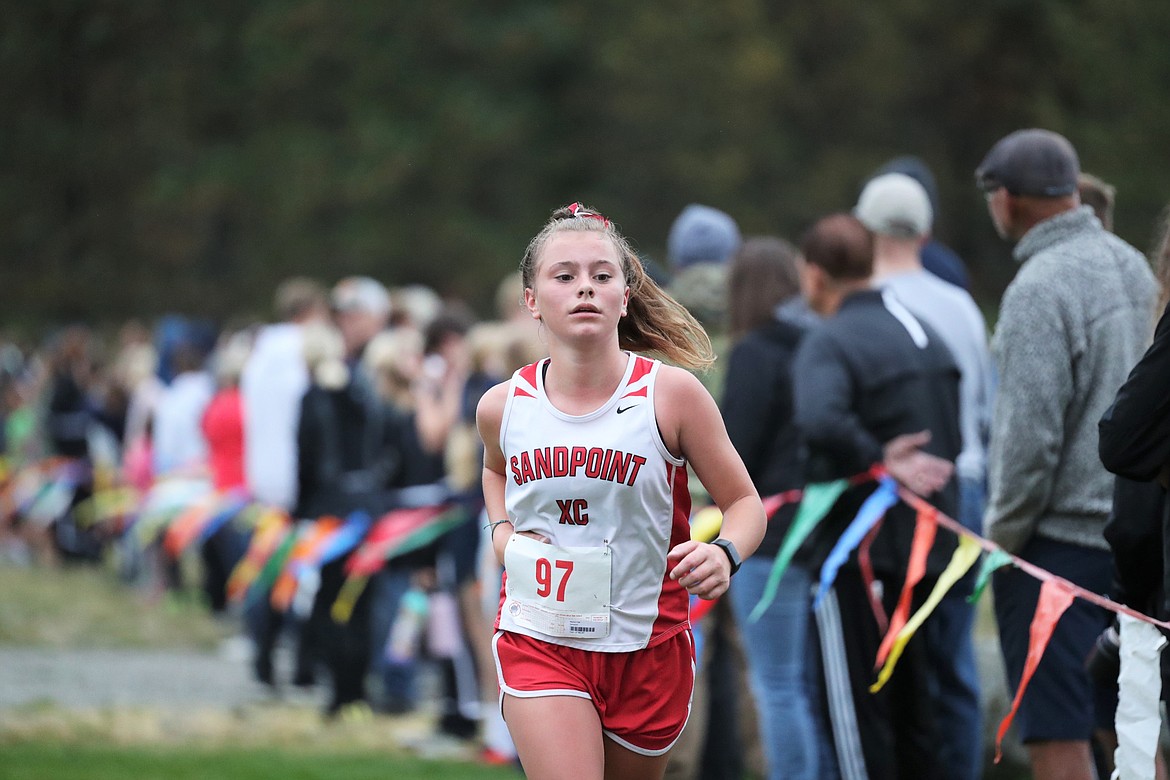 Madison Hall nears the finish of the girls JV race.