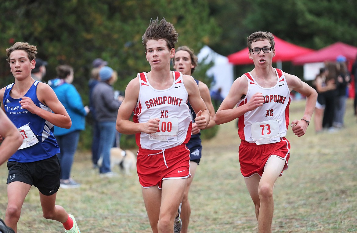 Trey Clark (left) and Nathan Roche run side-by-side during Saturday's meet.