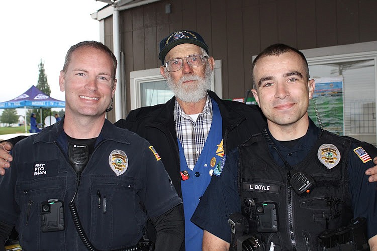 From left: Post Falls Police Officer Finan, Knight Don Beck and Police Officer Boyle.