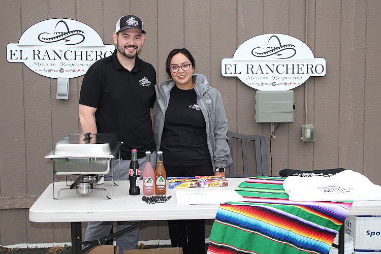Owners of the El Ranchero Mexican Restaurant in Post Falls and tournament sponsor, Mr. and Mrs. Juan Hernandez hand out complimentary swag and food during the tournament.
