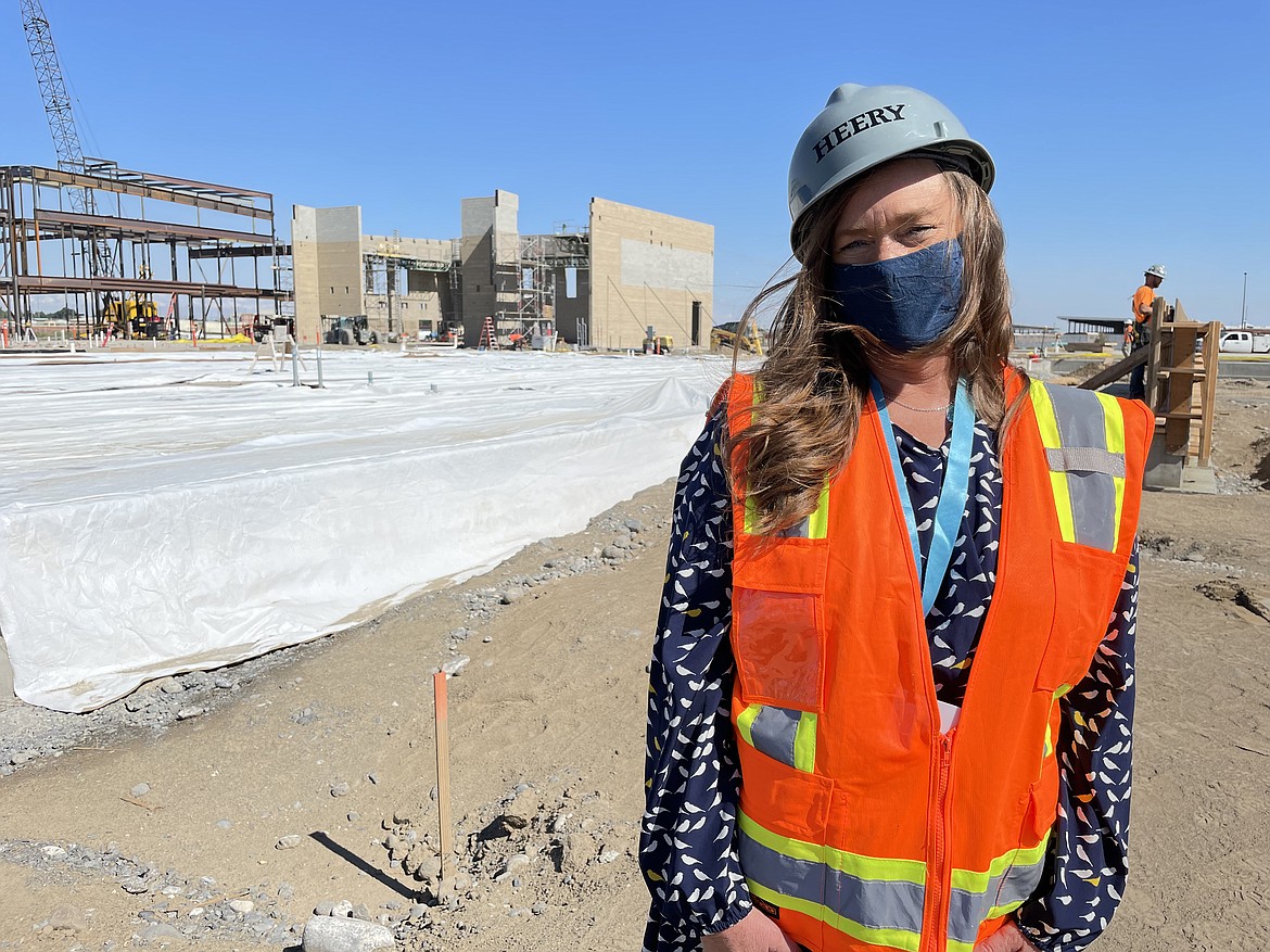 Kelly Cutter, the planning principal for the Moses Lake School District’s new high school, stands at the construction site on Monday.