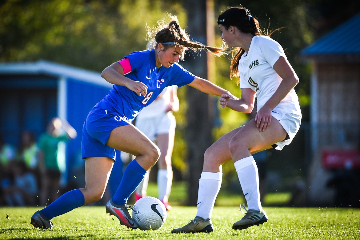 Columbia Falls' Cheyanne Johnston-Heinz (8) works the ball upfield in the second half against Whitefish at Columbia Falls High School on Tuesday, Sept. 14. (Casey Kreider/Daily Inter Lake)