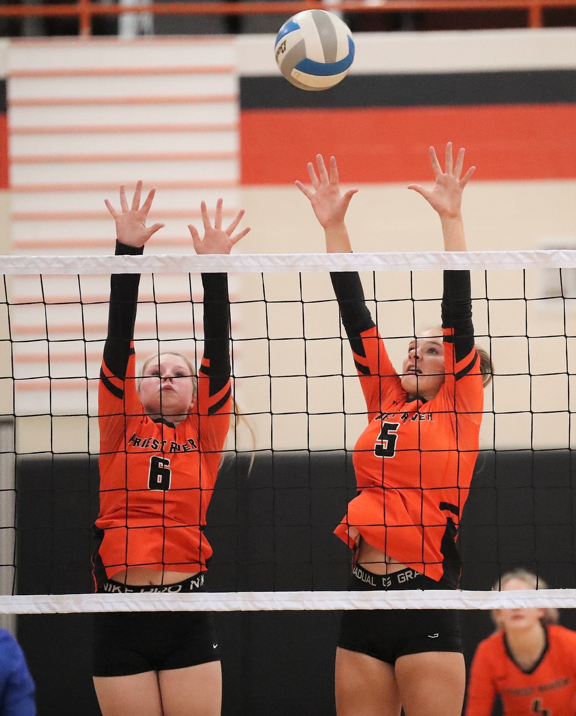 Desarai Humphrey (left) and Helena White elevate for a block during Thursday's match against Clark Fork.