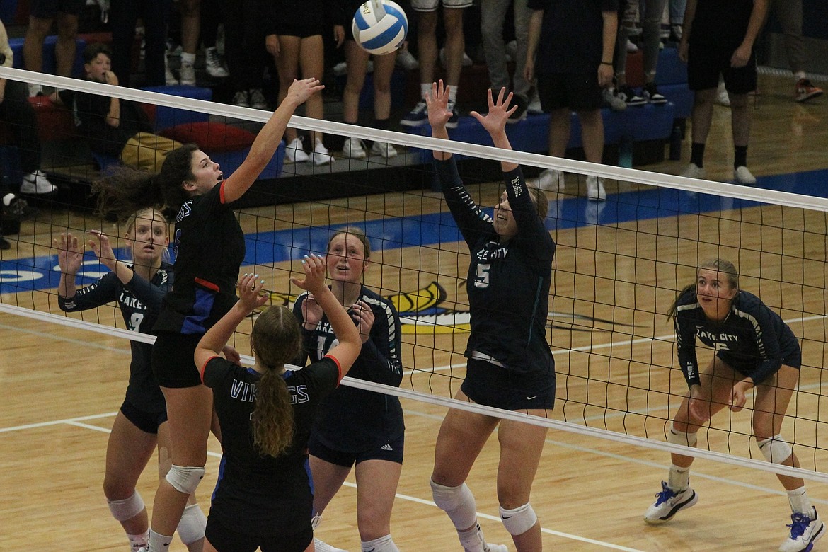 MARK NELKE/Press
Skylar Burke of Coeur d'Alene hits as teammate Madi Symons covers against Lake City on Tuesday night. Defending for the Timberwolves are Olivia Liermann (9), Emberlyn Reynolds (14), Nellie Reese (5) and Ella Hosfeld (6).