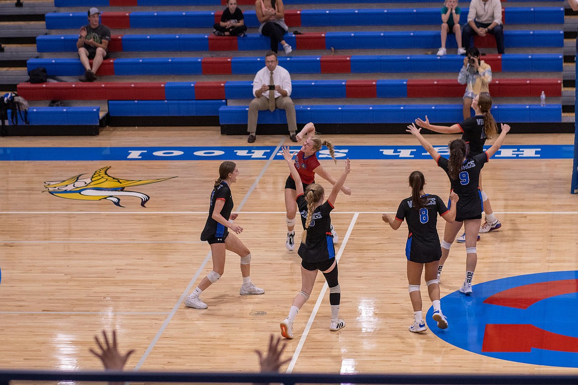 Photo by JERRY VICK
Coeur d'Alene High players celebrate after beating Lake City on Tuesday night at Coeur d'Alene High's Viking Court.