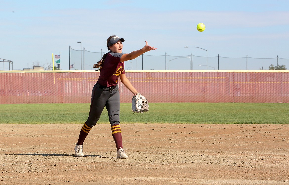 Moses Lake freshman Paige Richardson tosses a pitch in her first-ever varsity game on Tuesday afternoon against Sunnyside High School.