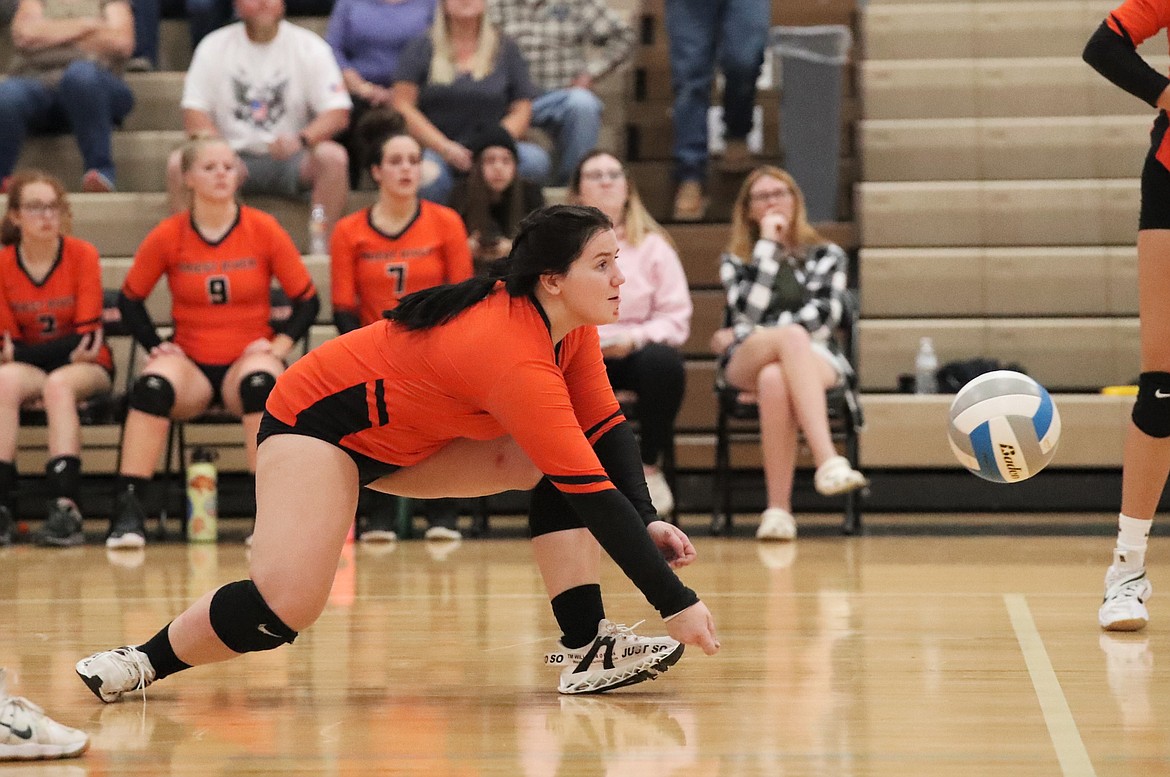 Madilyn Rose gets down low for a dig during Thursday's match against Clark Fork.
