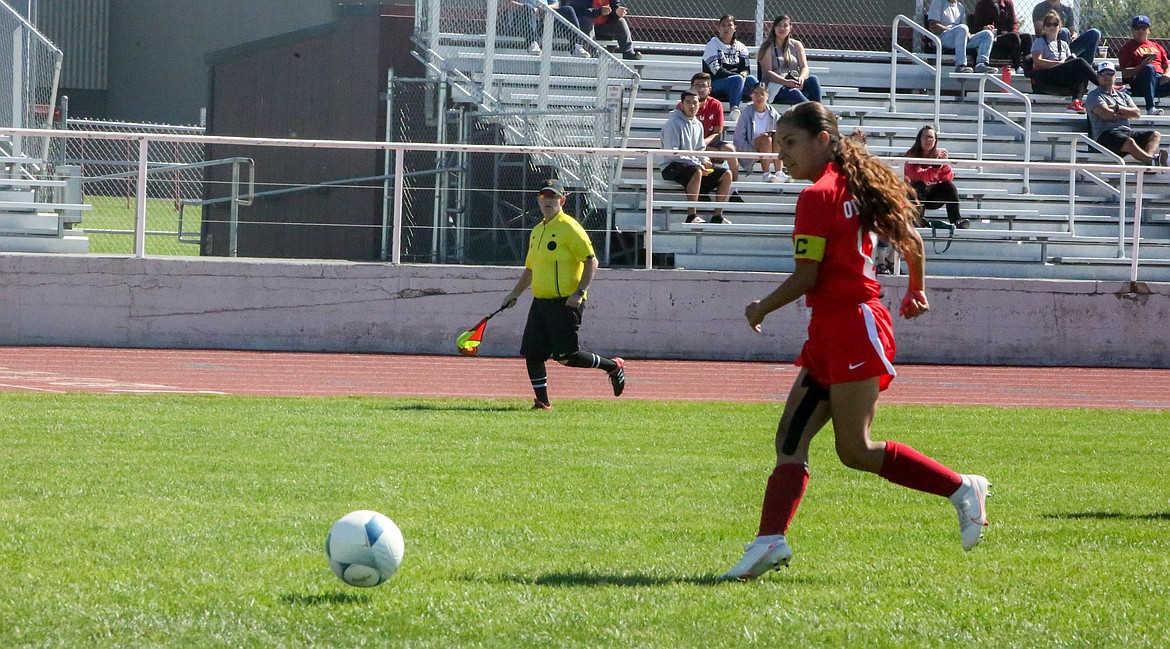 Othello High School senior Hailee Guzman fires in a shot in the first half to tie the game.