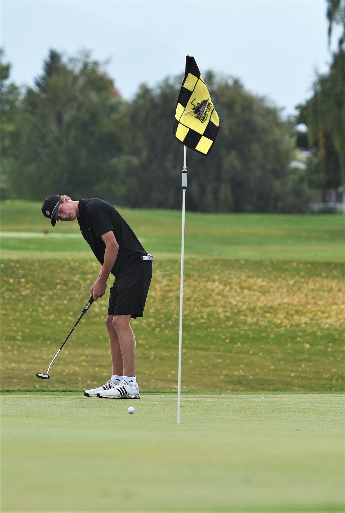 Polson's Carson Hupka strokes a putt on his way to a 76 Monday at Polson Bay Golf Course. (Scot Heisel/Lake County Leader)