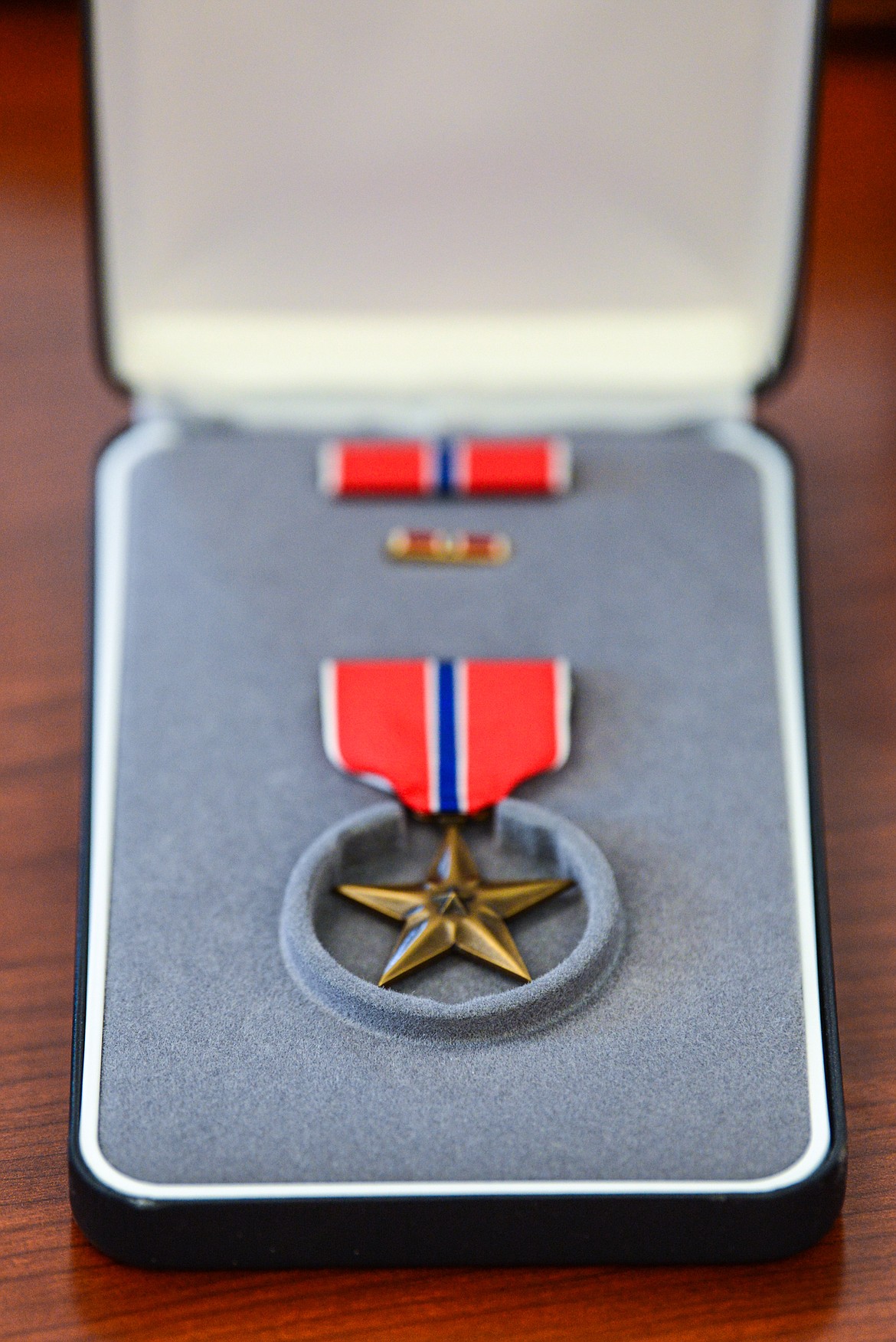Montana Gov. Greg Gianforte presented this Bronze Star to the family of U.S. Army 2nd Lt. John "Jack" Mulder, a World War II soldier who went missing after a battle in Germany five days after his son's birth in November 1944. (Casey Kreider/Daily Inter Lake)