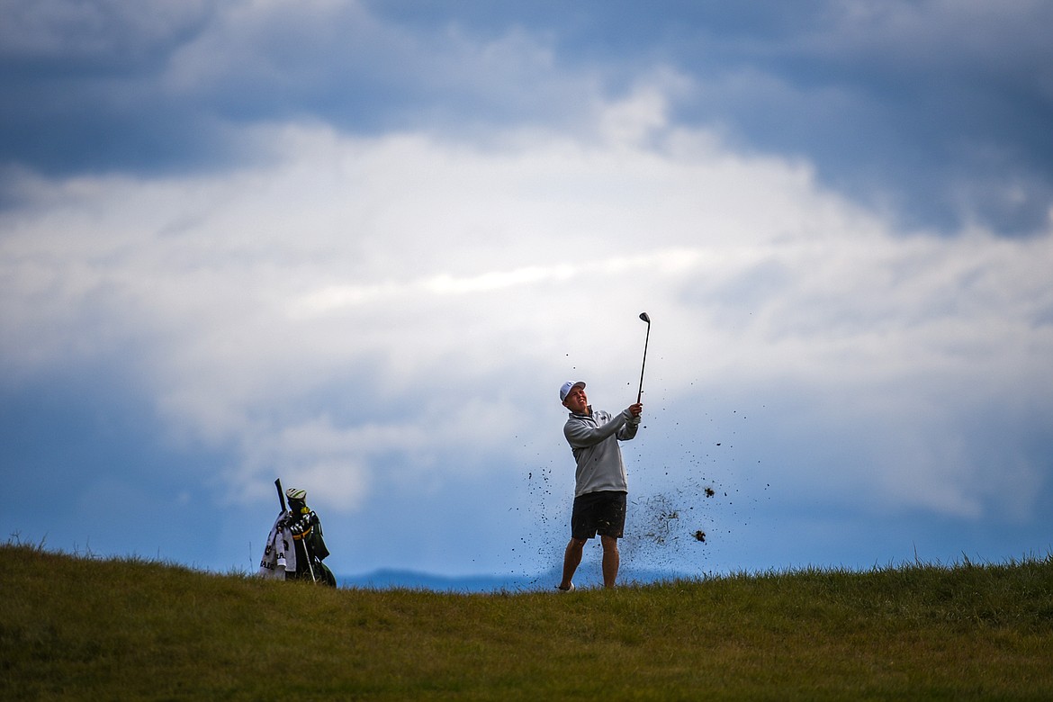 Whitefish's Johnny Nix chips his approach shot out of the rough and onto the green on the 12th hole at Northern Pines Golf Club during the Kalispell Invite on Wednesday, Sept. 15. (Casey Kreider/Daily Inter Lake)