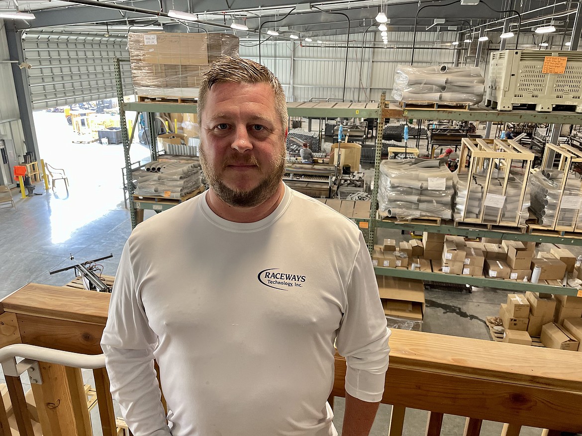 Josh Paul, third-generation owner of Raceways Technology, stands in the company’s new Quincy production facility, where it makes fittings and elbows for PVC and fiberglass pipes.