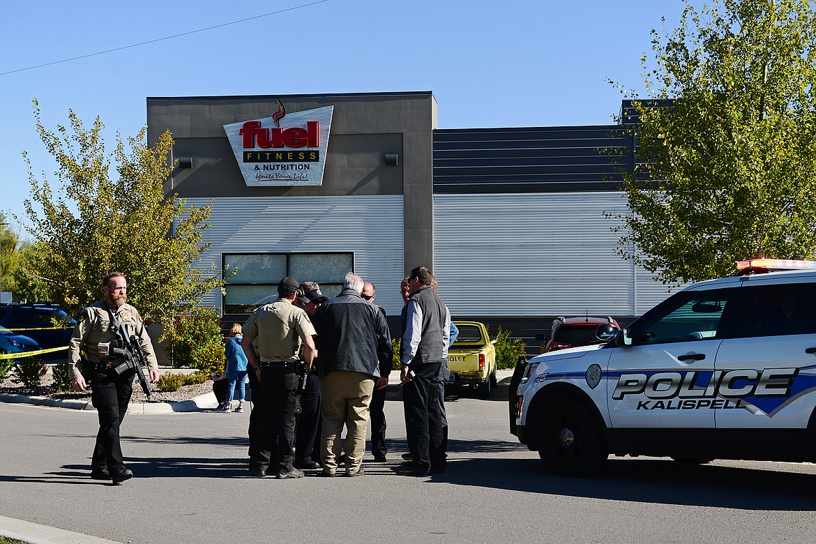 Law enforcement stand at the scene of a shooting outside Fuel Fitness in Kalispell on Thursday, Sept. 16. (Casey Kreider/Daily Inter Lake)