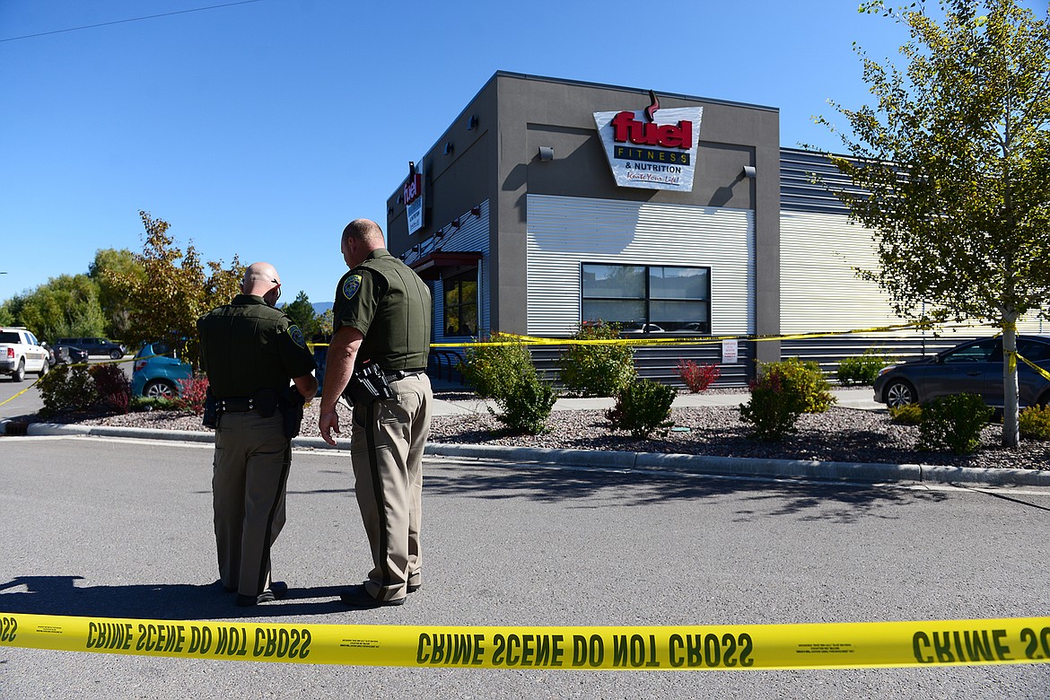 Law enforcement stand at the scene of a shooting outside Fuel Fitness in Kalispell on Thursday, Sept. 16. (Casey Kreider/Daily Inter Lake)