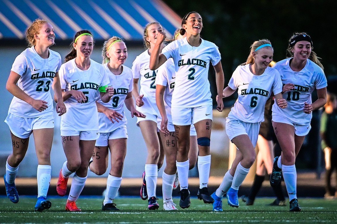 Glacier's Calista Wroble (2) celebrates with teammates after her goal in the second half against Flathead at Legends Stadium on Thursday, Sept. 16. (Casey Kreider/Daily Inter Lake)