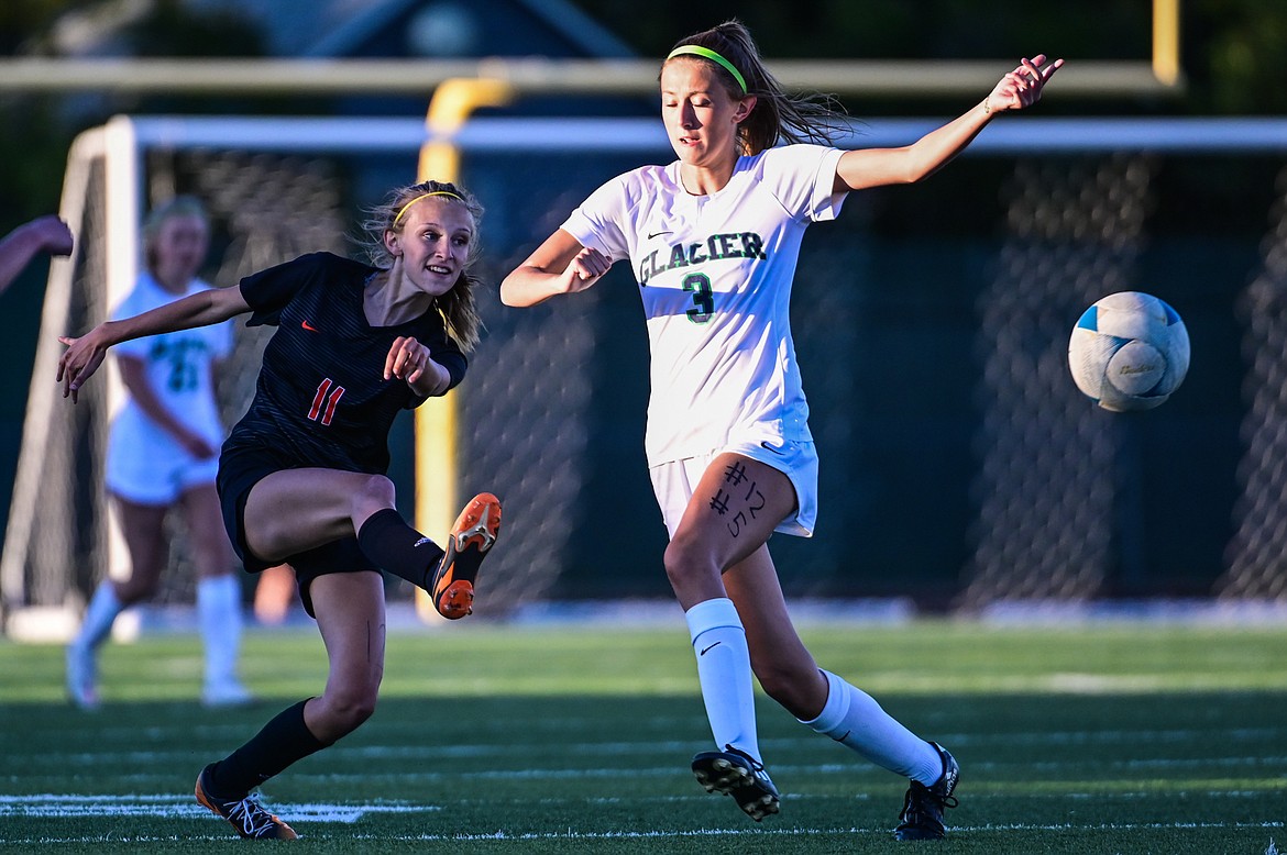 Flathead's Mia Stephan (11) looks to shoot in front of Glacier's Paige Scherer (3) in the second half at Legends Stadium on Thursday, Sept. 16. (Casey Kreider/Daily Inter Lake)