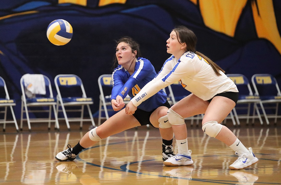 Caiya Yanik (left) and Lilly Reuter both go for a dig on Thursday.