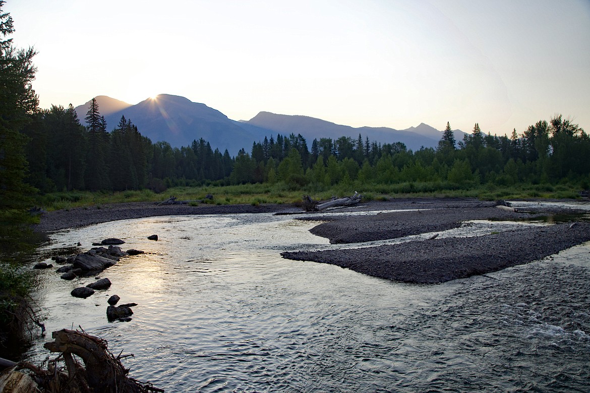 The sun breaks over the Swan Range reflecting on Swan River on a clear day. (Photos by Kay Bjork)