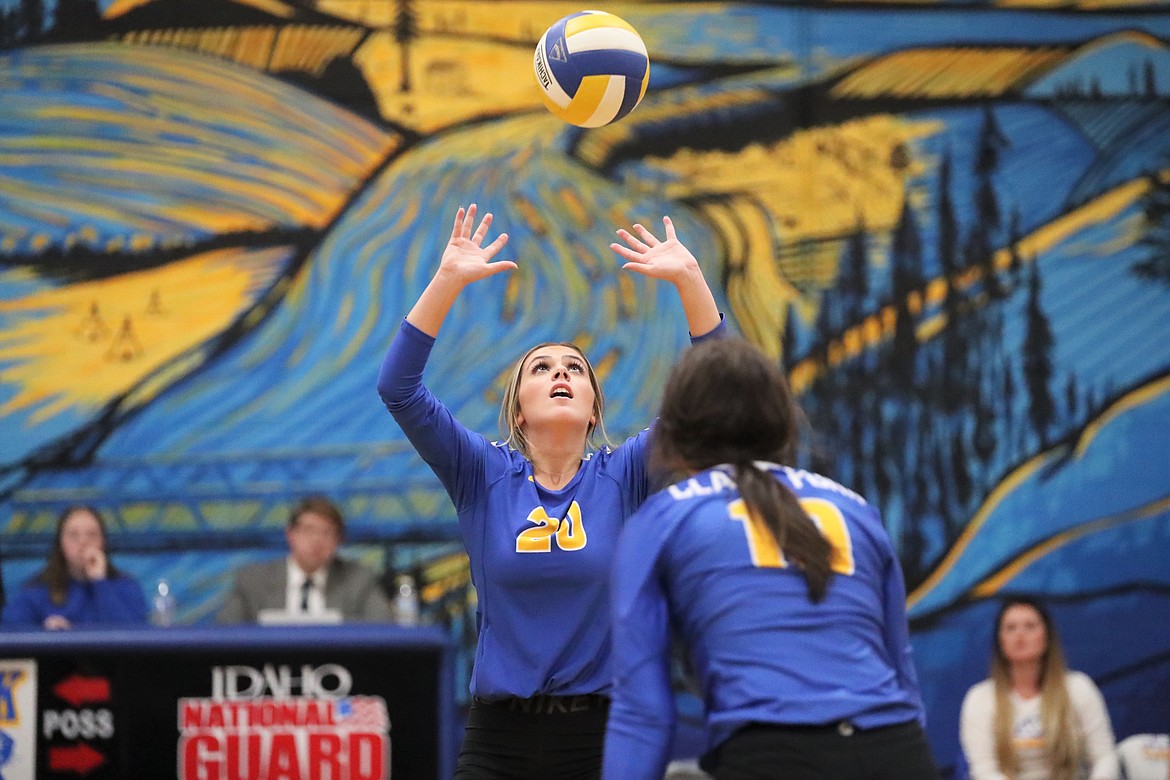 Paige Valliere sets the ball for Caiya Yanik during Thursday's match.