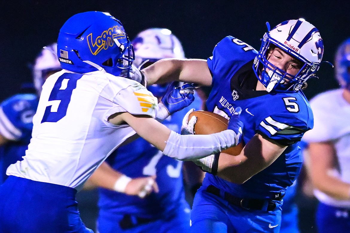 Columbia Falls running back Isaiah Roth (5) picks up yardage on a second quarter run against Libby at Satterthwaite Field on Friday, Sept. 17. (Casey Kreider/Daily Inter Lake)