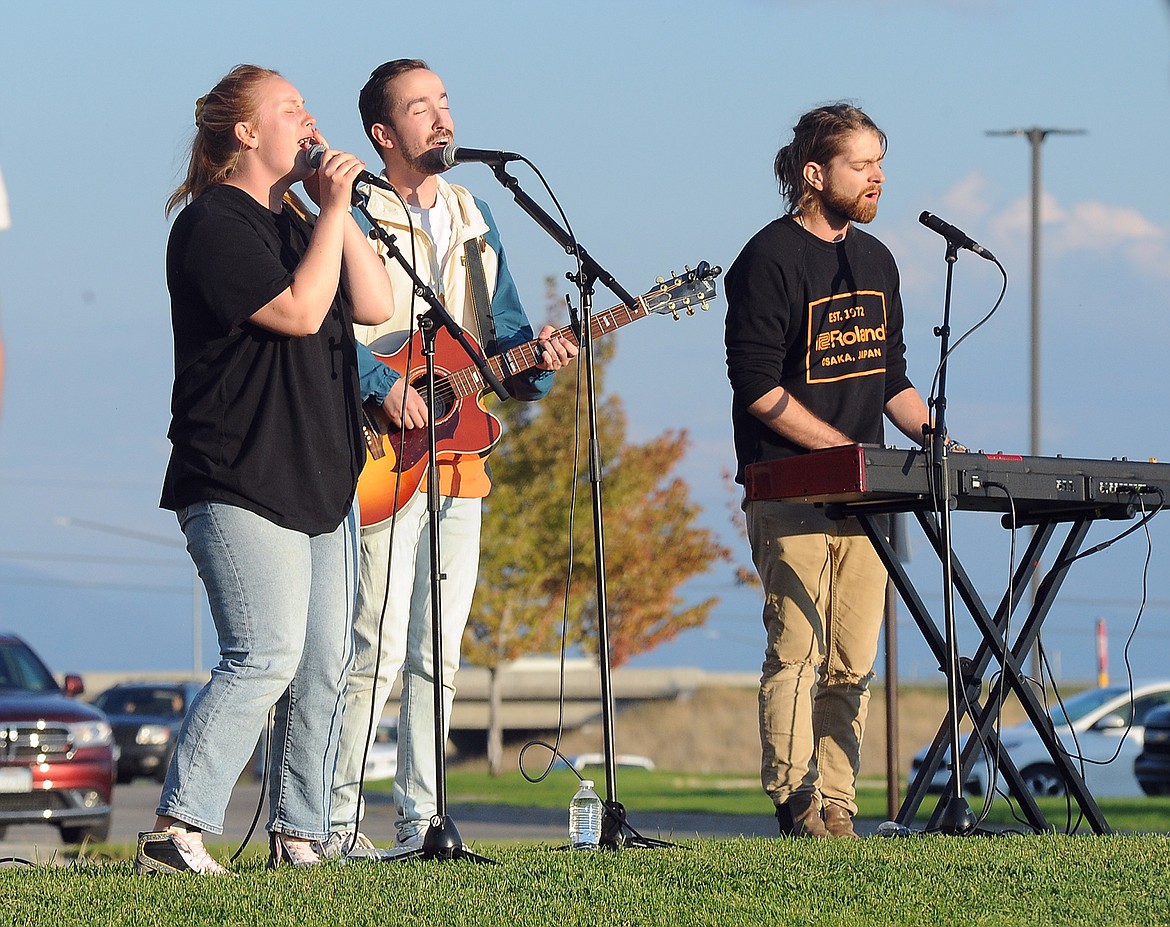 Fresh Life Worship Leaders Liz Hashley, Leon Gregory and Solo Ray lead participants in song on Monday, Sept. 13, 2021, at Glacier High School.  (Hilary Matheson/Daily Inter Lake)