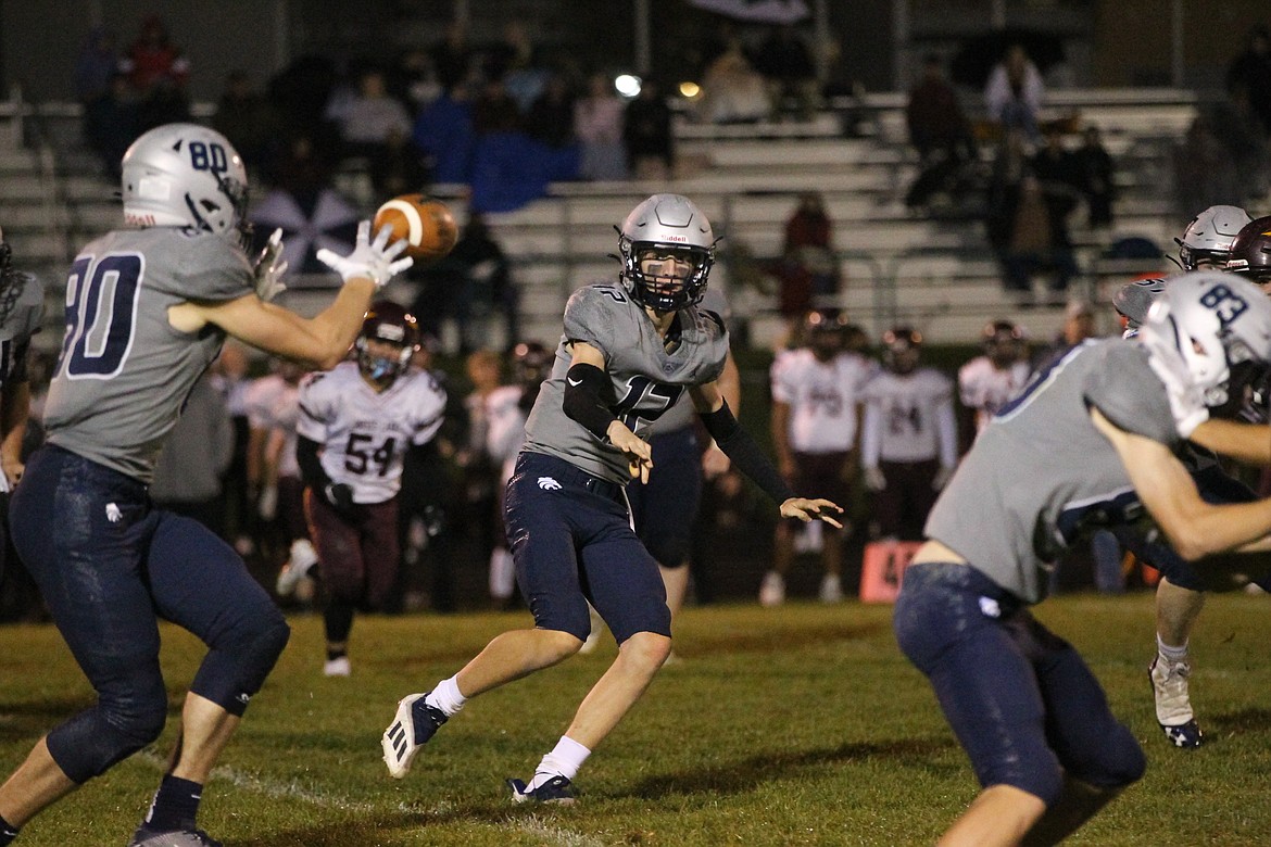 MARK NELKE/Press
Lake City quarterback Jackson Pettit (12) pitches to Zach Johnson in the second half Friday against Moses Lake.