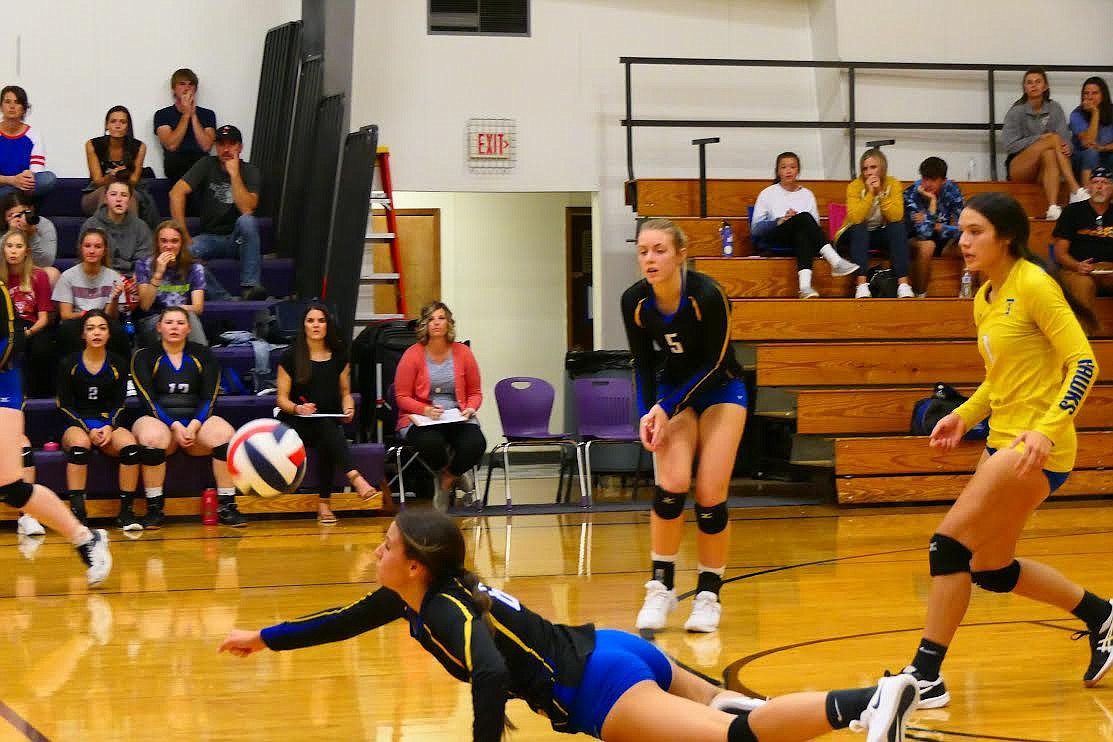 Thompson Falls players dive for a dig against Charlo. The Lady Hawks also scored a win over Eureka last week. (Chuck Bandel/Valley Press)