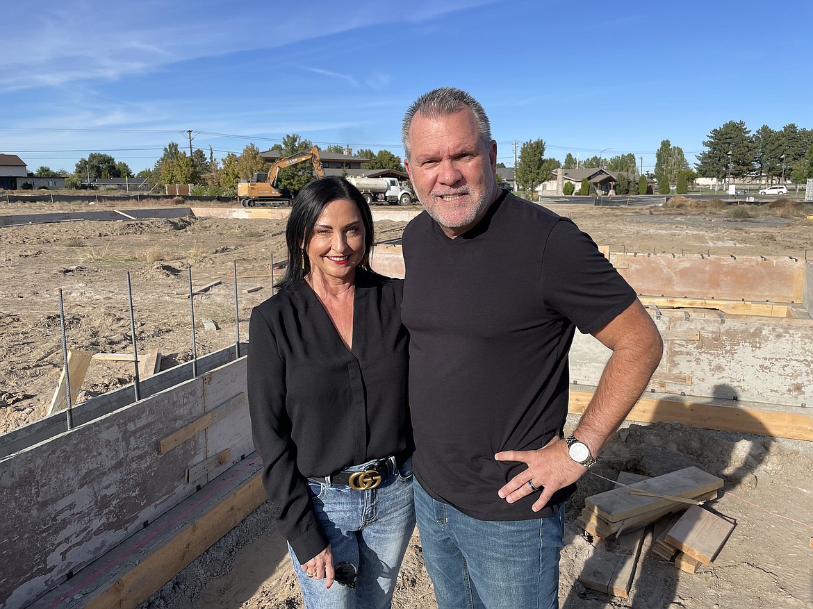 Rhonda and Dino Cacchiotti stand next to the foundation of their new venture ENZO Italian Restaurant, which should be open by June 2022 and will feature “a traditional Italian menu,” Dino Cacchiotti said.