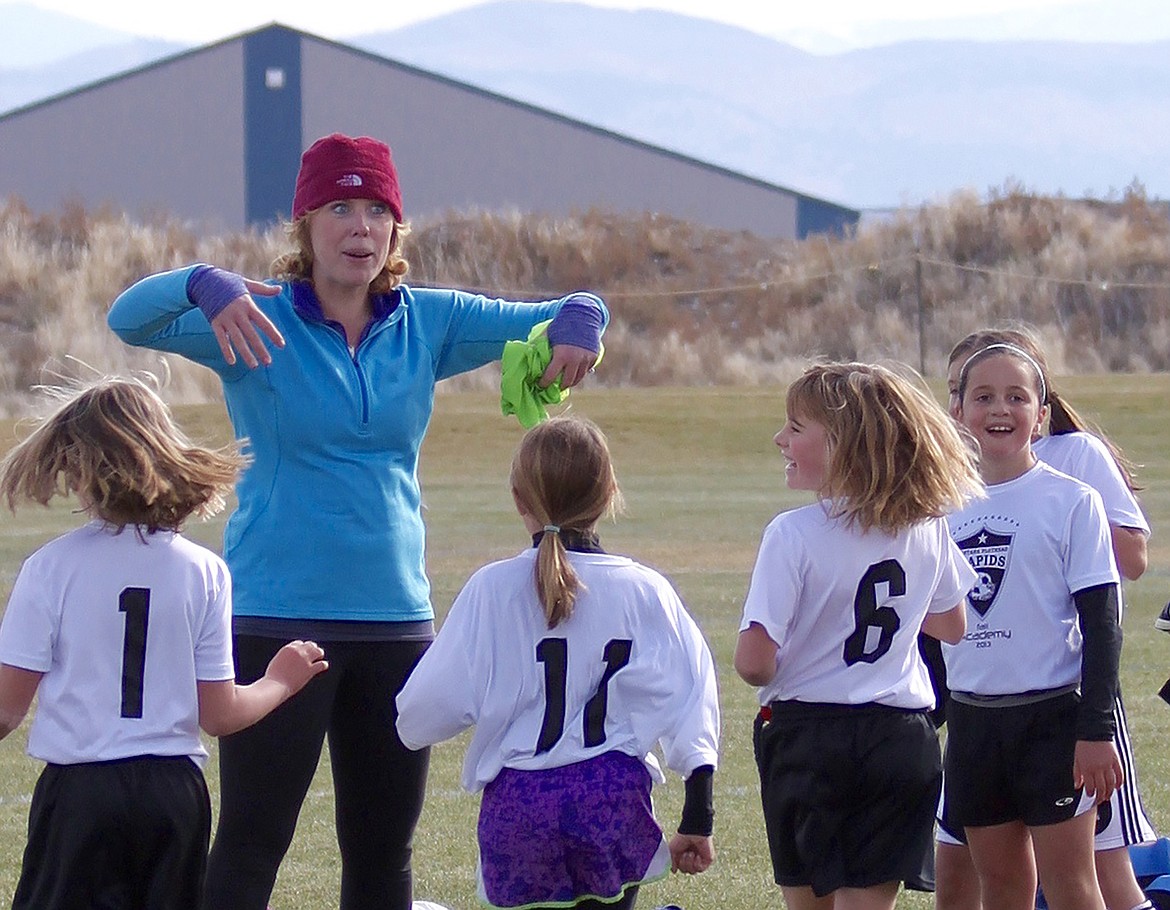 Whitefish youth soccer coach Kelsey Whitby with the young girls she coached before and after being diagnosed with an aggressive form of brain cancer. (Courtesy photo)