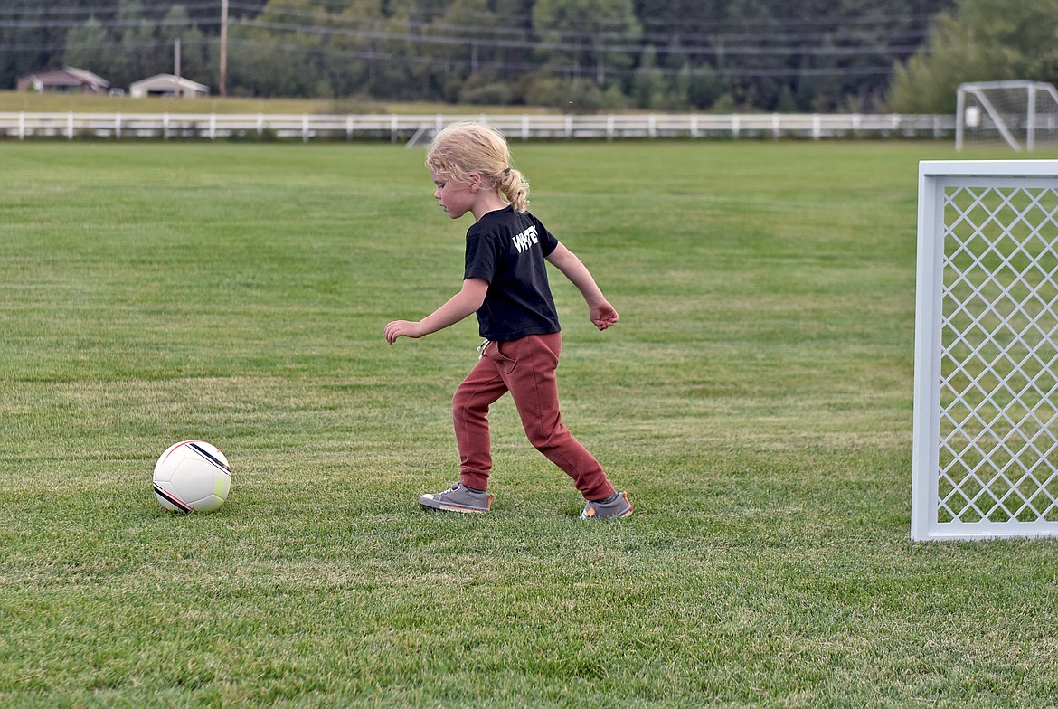 Derrick and Kelsey Whitby's son, Otto, had the honor of scoring the first goal on the micro field dedicated to his mother at Smith Fields recently. (Whitney England/Whitefish Pilot)
