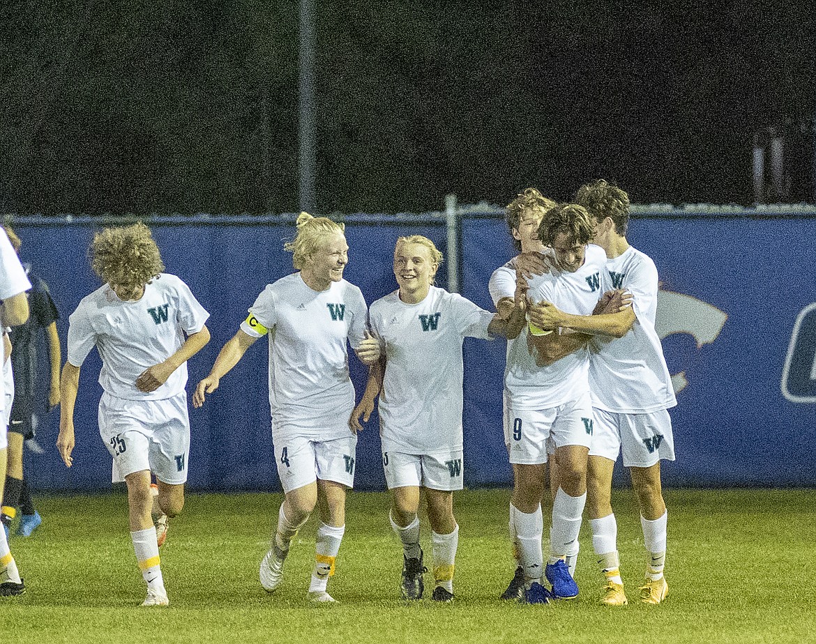 The Whitefish boys team celebrates a goal in the second half on Tuesday night in Columbia Falls. (Chris Peterson/Hungry Horse News)