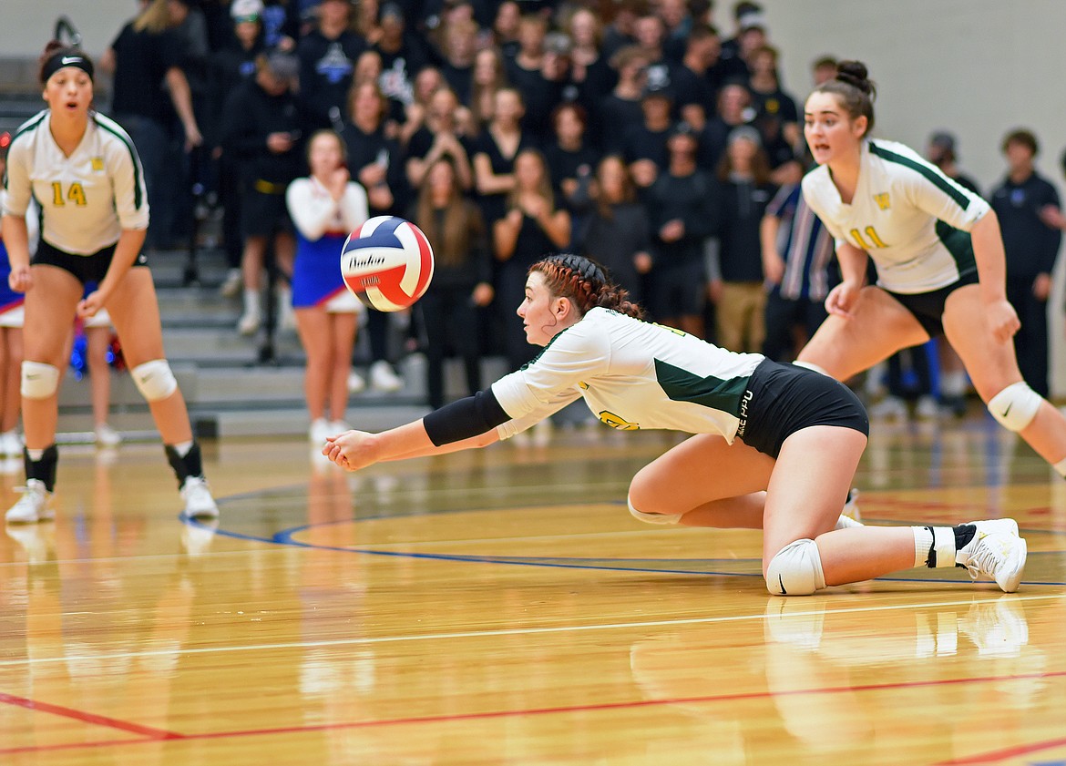 Bulldog Jadi Walburn dives for a ball during a volleyball match against the Wildkats in Columbia Falls on Saturday. (Whitney England/Whitefish Pilot)