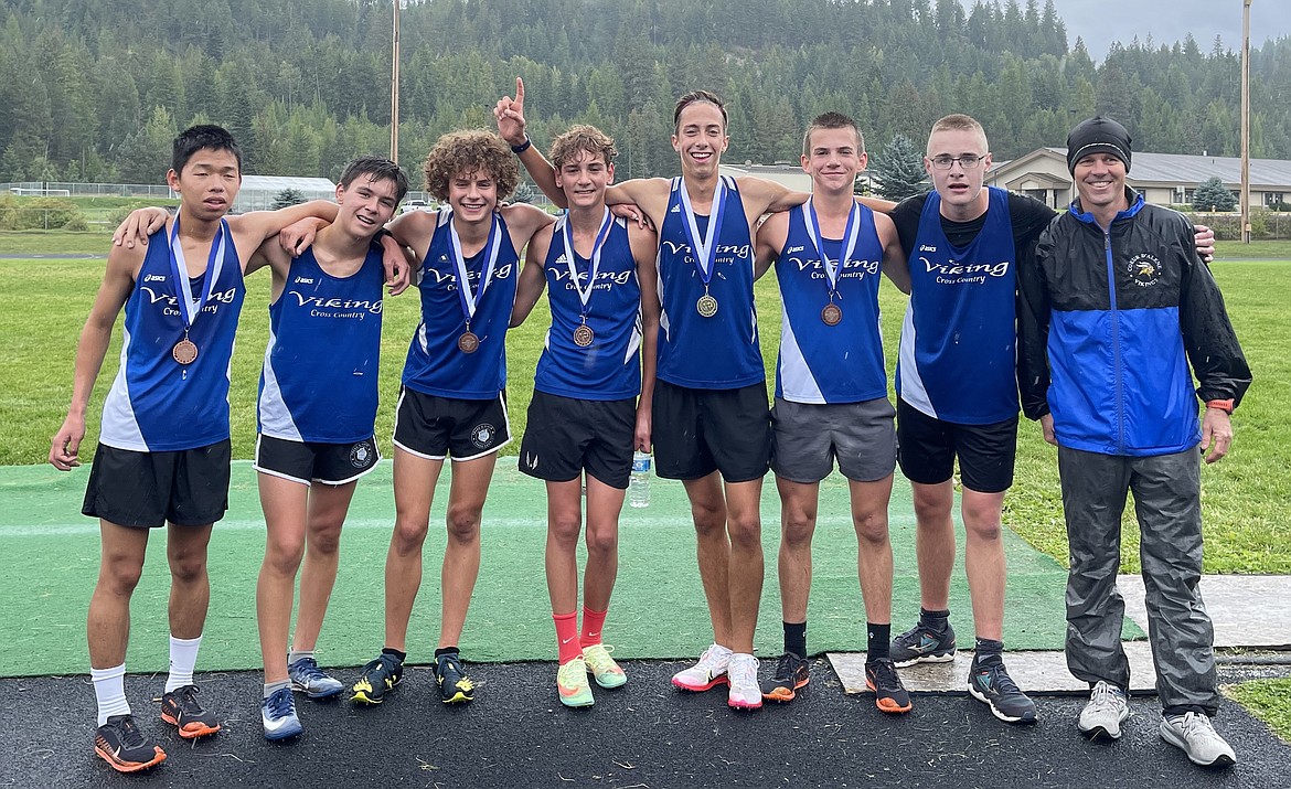 Courtesy photo
The Coeur d'Alene High boys cross country team won the Bonners Ferry Invitational on Sept. 18. It was the third team title in as many meets for the Vikings, who also won at Libby (Mont.) and Farragut. From left are William Callahan, Ethan Hickok, Kyle Rohlinger, Zack Cervi-Skinner, Jacob King, Lachlan May, Levi Bird and assistant coach Justin Taylor.