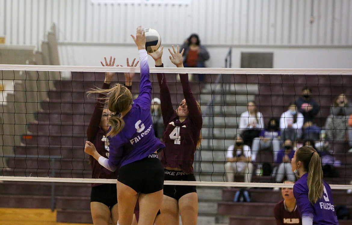 Moses Lake’s Sydney Macdonald, left, and Morgan Ross, 4, right, go up for a block against visiting Hanford High School  on Saturday in Moses Lake.