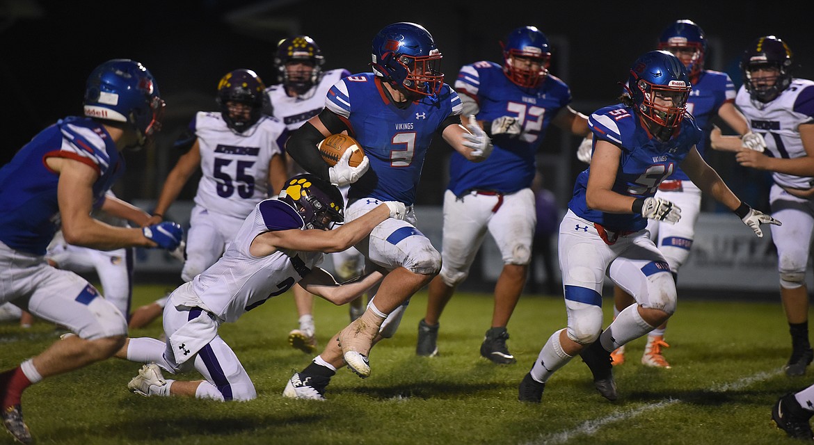 Bigfork running back Levi Taylor runs past a Panther defender Friday in the Vikings' 20-19 win over Jefferson. (Jeremy Weber/Bigfork Eagle)