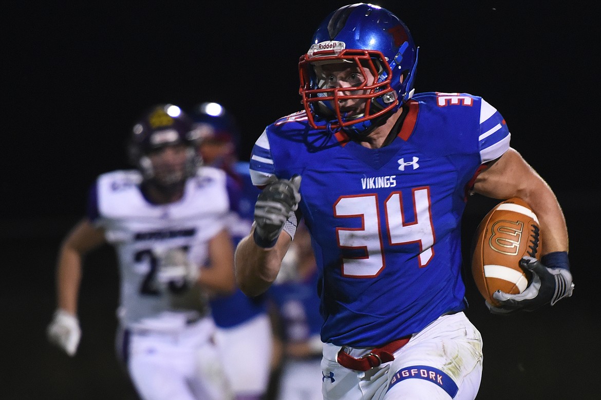 Bigfork's Joseph Farrier breaks free for a 36-yard touchdown run in the second quarter against Jefferson Friday. (Jeremy Weber/Bigfork Eagle)