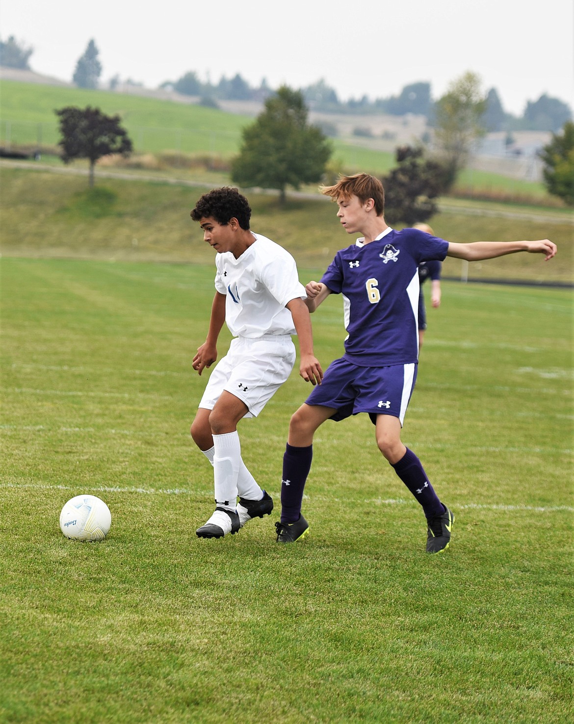 Polson's Lucian Sawyer (6) defends as Libby's Sami Jocks looks for a shot. (Scot Heisel/Lake County Leader)