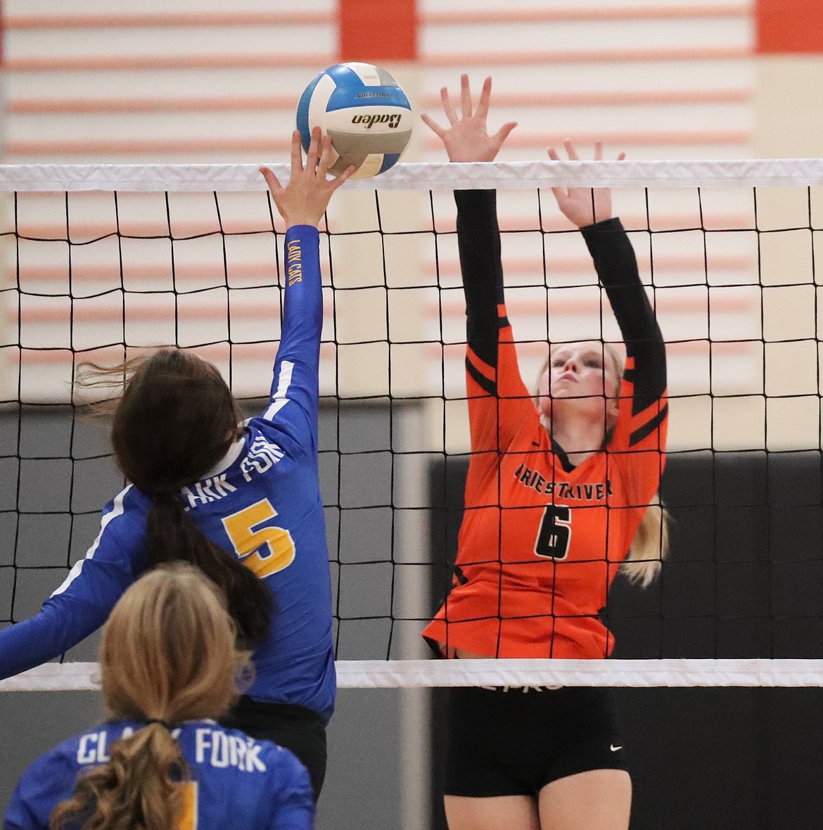 Freshman Desarai Humphrey rises up to attempt to block a hit by Clark Fork's Taylor Staley on Sept. 9 at PRLHS. She tallied 36 assists across two IML matches last week.