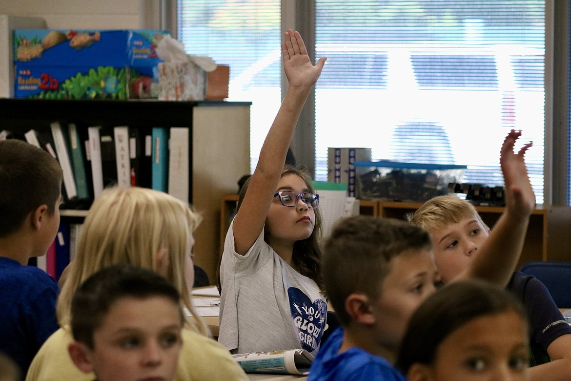 Ten-year-old Ava Bauer, a fifth-grader at Twin Lakes Elementary School, waits her turn to give a response to the weekly writing prompt in Kid Scoop, a section of the newspaper for kids. HANNAH NEFF/Press