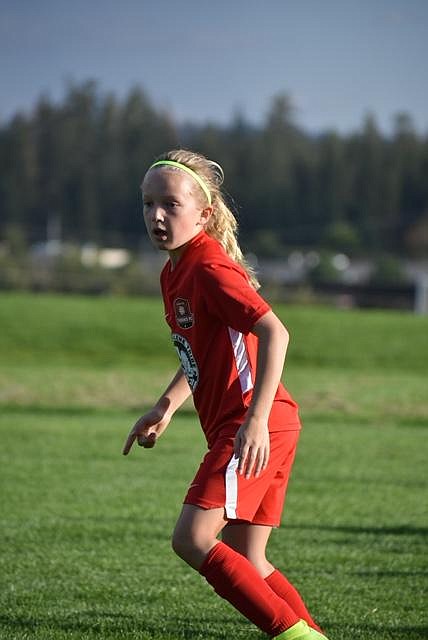 Photo by KARI HYNES
The Thorns FC 11 Girls Green soccer team played in their second tournament of the season this last week, the Pend Oreille Cup in Sandpoint. The Thorns finished with 2 losses and 1 win. In game one Riley Greene (pictured) and Emilia Meyer each scored 1 goal during the Thorns' 5-2 loss against FC Spokane. This game was followed by a 4-2 loss to the Sandpoint Strikers. The Thorns' two goals came from Payton Brennan and Olivia Hynes, assisted by Zoe Lemmon. The girls finished the tournament strong with a 1-0 win over the Thorns FC 11 Girls Yellow. Amelia Liddiard scored the game's only goal and Gracie McVey and MacKenzie Dolan split time in goal to shut out the opposing team.