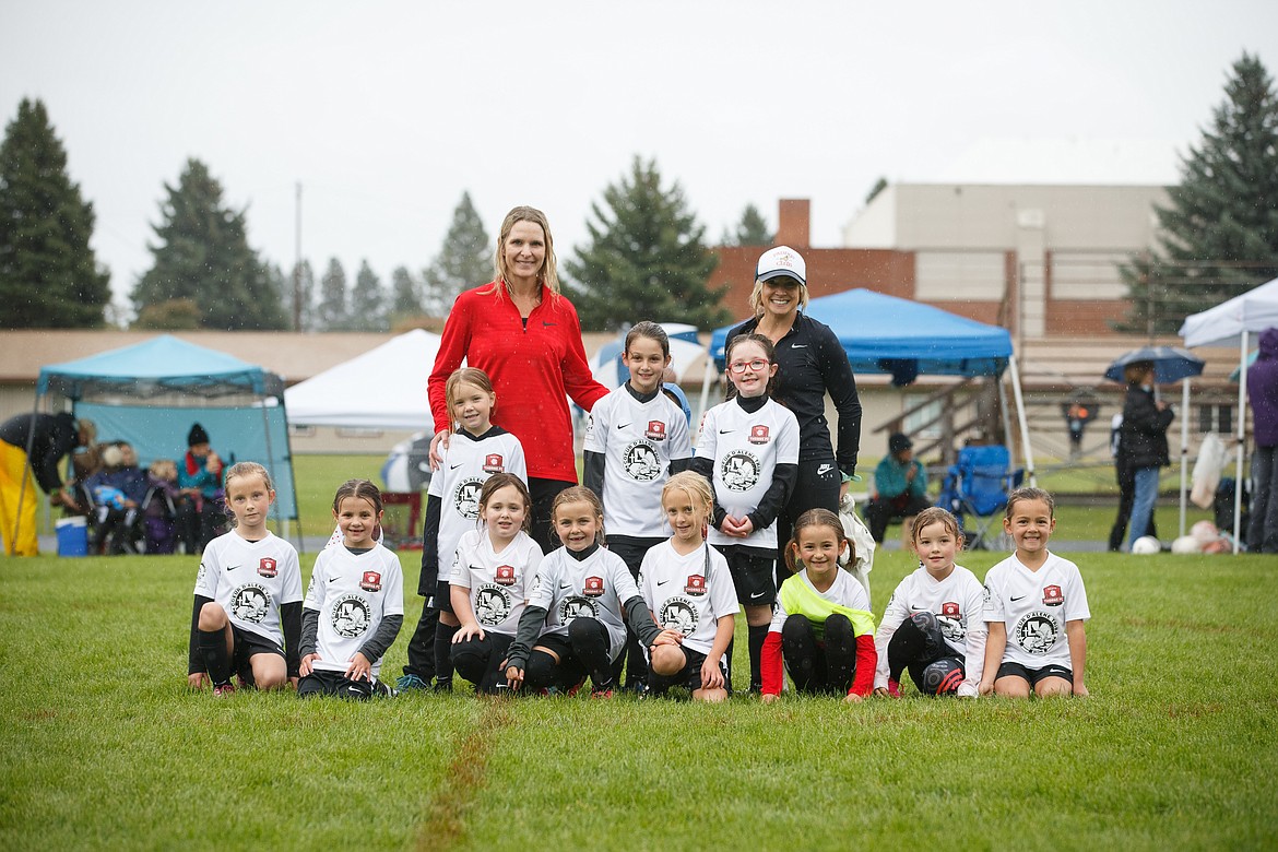 Photo courtesy BUSCEMA PHOTOGRAPHY
The Thorns North FC 14 Girls soccer team competed in the Pend Oreille Cup in Sandpoint this past weekend. The team battled through the pouring rain, winning both games on Saturday vs FC Spokane 8-3 and vs Sandpoint Strikers 3-0, to make it to the finals on Sunday, where the Thorns finished second by a 2-1 score. Thorns goals on the weekend were made by Finley Martin, Lyla Maestas, Stella Hartzell, and Hatty Lemmon. In the front row from left are Emma Thompson, Stella Hartzell, Grace Rudd, Eloise Carper, Hatty Lemmon, Audrey Rietze, Lillian Webb and Finley Martin; second row from left, Avery Doran, Brielle Buscema and Lyla Maestas; and back row from left, coaches Kara Lemmon and Jean Carper.