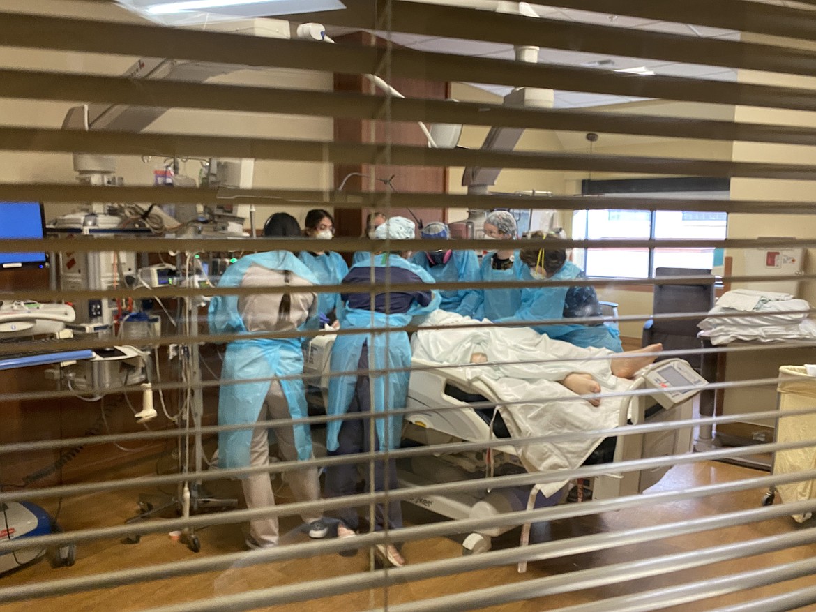 Nurses at the Billings Clinic prepare to turn a patient from his stomach onto his back in the hospital's intensive care unit on Friday, Sept. 17, 2021. (Courtesy of Billings Clinic)