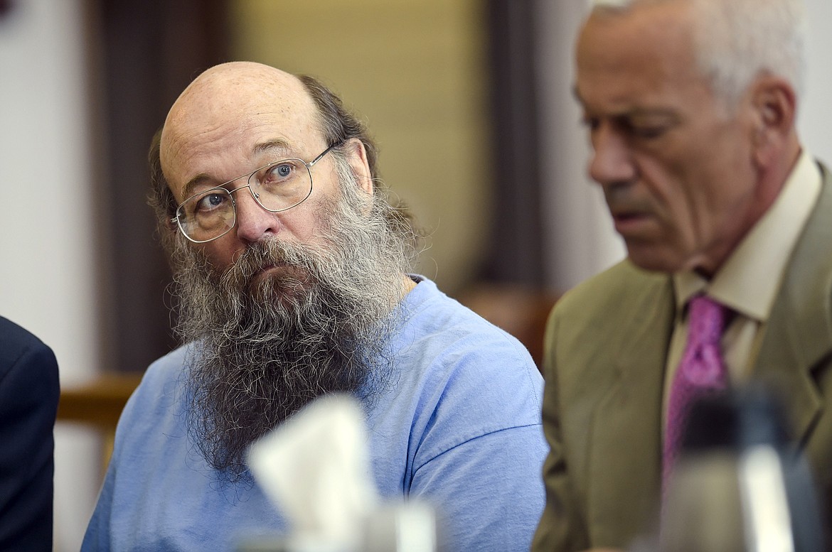 In this June 7, 2018, file photo, is Lloyd Barrus, left, alongside his defense attorney, Craig Shannon, appearing before District Court Judge Kathy Seeley in the Lewis and Clark County Courthouse in Helena. Barrus was convicted on Tuesday, Sept. 21, 2021, of accountability to deliberate homicide in the shooting death of Broadwater County Sheriff's Deputy Mason Moore on May 16, 2017. (Thom Bridge/Independent Record via AP)