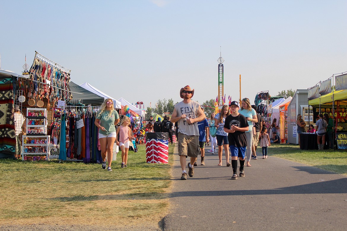 Fairgoers make their way down the pathway at the 2021 Grant County Fair.