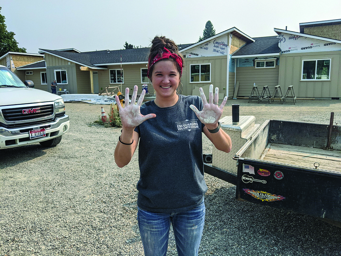 A First Interstate Bank employee volunteers at Habitat for Humanity.