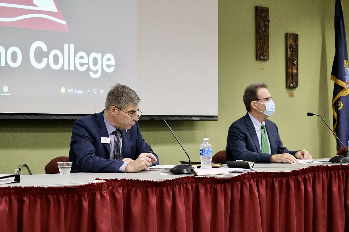 North Idaho College Board of Trustees chair Todd Banducci, left, voted to terminate college President Rick MacLennan in a motion that passed Wednesday night at the board meeting on NIC's main campus. HANNAH NEFF/Press