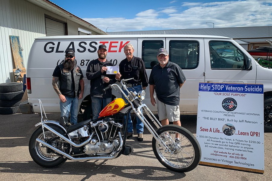 From left, Jeff Peterson, of Bodhisattva Cycles, Nate Gebhart, Mike Shepard and Mike Stone, both with the Veterans Coalition of Northwest Montana, stand with a custom 1972 Harley Davidson Ironhead built by Peterson and won by Gebhart, a Kalispell resident, outside Vintage Technologies on Thursday, Sept. 23. The Veterans Coalition held a fundraiser to raise money for a Question, Persuade and Refer suicide awareness program and to provide outreach to veterans and Gebhart was the winner of the raffle and the bike.